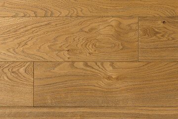 Fototapeta premium Texture of natural oak parquet close-up. Wooden boards for polished laminate. Hardwood sample background