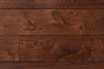 Texture of natural red oak parquet close-up. Wooden boards for polished laminate. Hardwood sample background