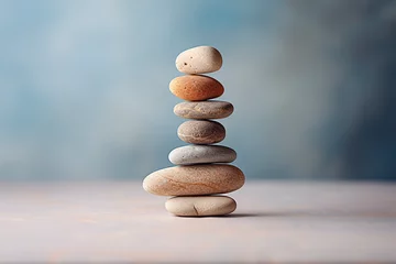 Fototapete Steine im Sand Pebble tower balance harmony pyramid stones arrangement on calm blue relaxing background. Simple poise stones, simplicity harmony and balance, rock zen sculptures concept