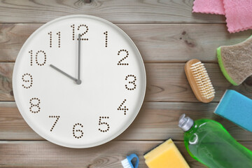 Kitchen clock. 10 o'clock. Clock hands at 10 am on background of cleaning sponges, detergent...