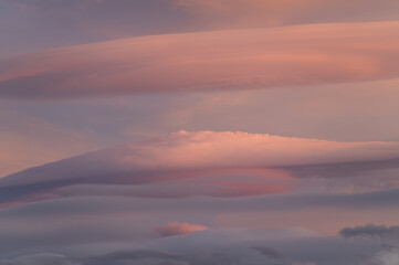 Beautiful lenticular clouds in the sky at sunset