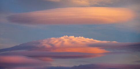 Beautiful lenticular clouds in the sky at sunset