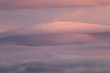 Beautiful lenticular clouds in the sky at sunset