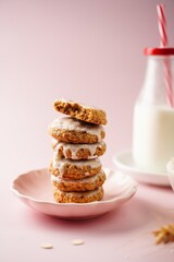 Homemade iced oatmeal cookies served with milk, selective focus