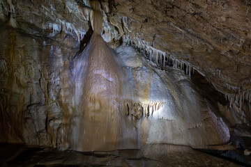 Bear Cave, amazing view of stalactites and stalagnites in colorful bright light, beautiful natural...