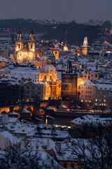 A winter evening enchants Charles Bridge and the cityscape of Prague. Prague, Czech Republic