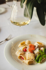 Appetizing pasta, ravioli with red caviar. Italian food, food photography.