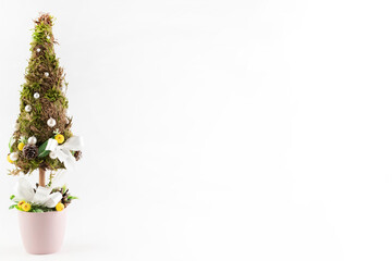 Obraz premium Decorative Christmas tree on a white background with a place for writing text. New Year background.