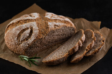 Farmer's healthy bread on a dark background.