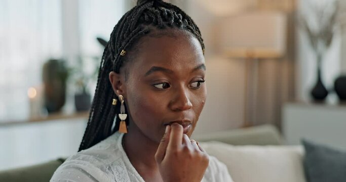 Stress, anxiety and woman biting nails in home with fear, worry and mental health risk. Face of african girl in living room with crisis of trauma, nervous habit and overthinking with doubt of mistake