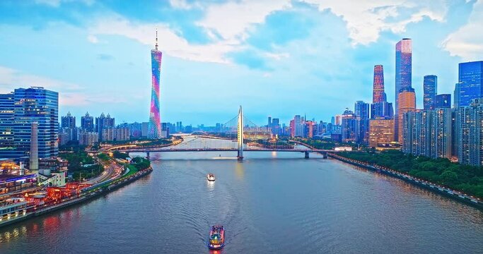 Aerial shot of city buildings skyline and river at sunset in Guangzhou, Guangdong Province, China