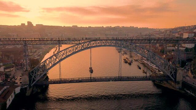 Aerial view of Porto with Luis I Bridge and Douro River at sunset. High quality 4k footage