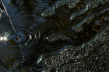 Desktop computer background. The water flows  sparkling with crystals. Abstract circle wave. Shiny...