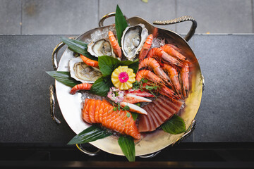 Restaurant serving seafood. Stylish food photography. asian food. Octopus tentacles, fish, shrimp,...