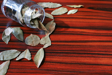 Bay leaves on the wooden table. Brazilian spices.