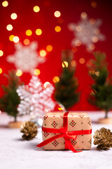 Christmas gift box on red background.