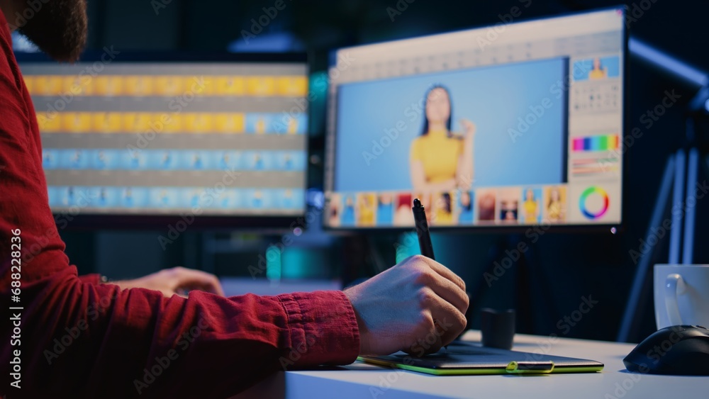 Poster expert photo editor browsing through photoshoot images to find and fix faulty spots using graphic ta