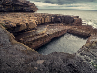 View on famous Poll na bPéist - The Wormhole, Inishmore, Aran islands, county Galway, Ireland....