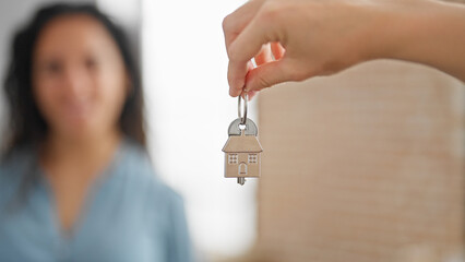 Man and woman couple receiving house key at new home