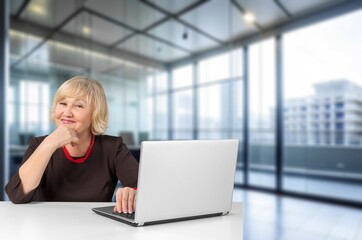 Mature female worker in modern office