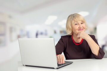 Mature female worker in modern office