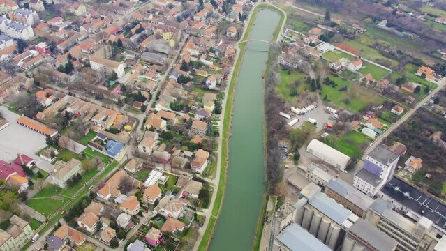 Long and narrow lake close to Bega river viewed from drone in town Zrenjanin