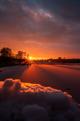 sunset over the iced lake 