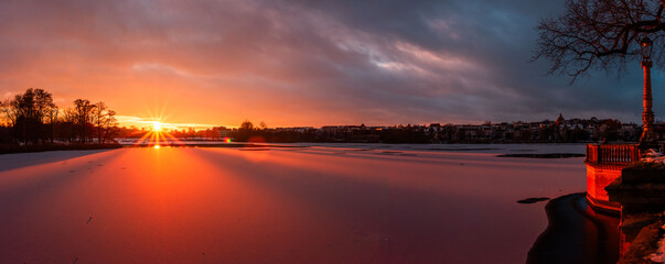 sunset over the iced lake 