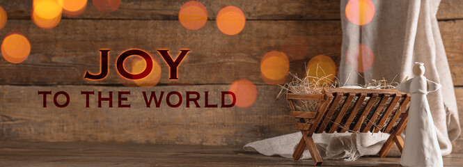 Manger with angel toy on wooden background. Concept of Christmas story - obrazy, fototapety, plakaty