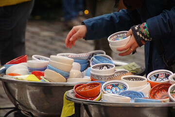 Selecting small porcelain bowls in Chritmas market