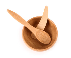 Wooden bowl, cosmetic spatula and spoon on white background