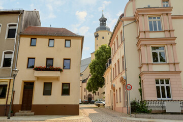 Fototapeta na wymiar View of city street with buildings and church