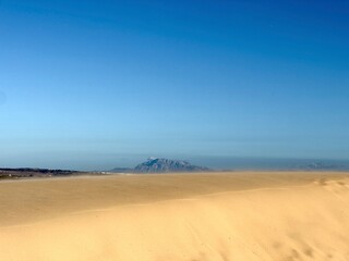 high sand dunes in Valdevaqueros with a view towards the Jbel Musa mountain in Morocco at the horizon, Spain, Tarifa, Andalusia, Strait of Gibraltar, Africa
