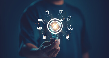 Businessman holding lightbulb with target icon. Business global internet connection application...