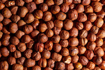 Scattered Peeled Hazelnut - Top View. Background from Hazelnuts. Natural High-Calorie Snacks