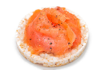 Tasty Rice Cake Sandwich with Fresh Salmon Slices Isolated on White. Easy Breakfast and Diet Food....