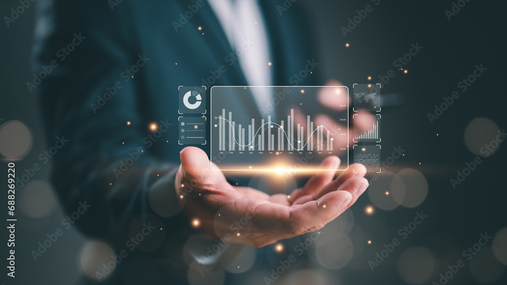 Poster businessman or analyst working with business analytics and data management system on virtual screen,