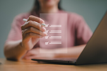 Business performance checklist, businessman using laptop doing online checklist survey, filling out digital form checklist, take an assessment, questionnaire, evaluation, online survey, online exam.