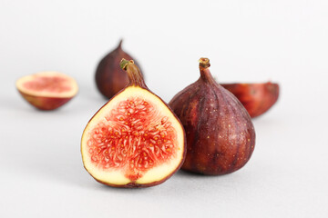 Fresh ripe figs on white background