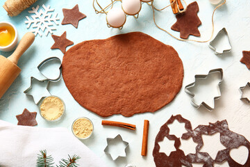 Fresh dough and ingredients for Christmas gingerbread cookies on gradient background