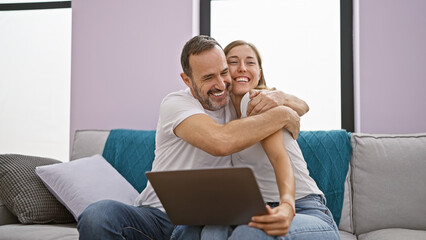 Casual lifestyle at home, confident father and lovely daughter enjoying fun internet time on...