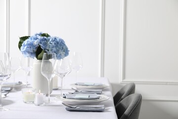 Beautiful table setting with floral decor indoors, space for text