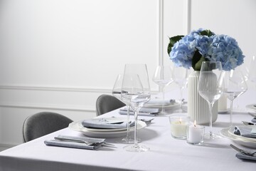 Beautiful table setting with floral decor indoors
