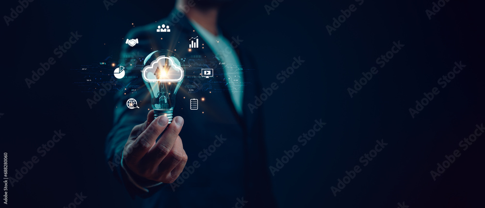 Aufkleber businessman holding light bulb with cloud computing diagram show on virtual screen. cloud technology