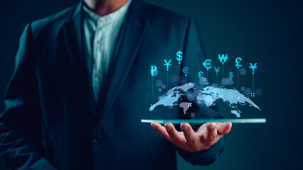 Global business and Global currency exchange concept, money, finance, Businessman holding tablet with virtual world map and connection line effect, dollar yuan yen euro and pound sterling sign. - obrazy, fototapety, plakaty