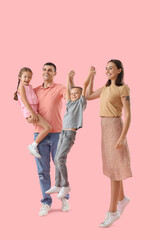 Obraz premium Happy family on pink background
