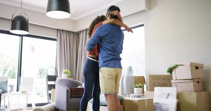 Homeowners, hug and couple with boxes, celebration and achievement with mortgage, real estate and excited. People, man and woman embrace, cardboard and rent with house, bonding and development