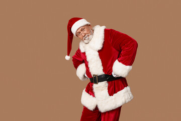 Fototapeta na wymiar Santa Claus in glasses on brown background
