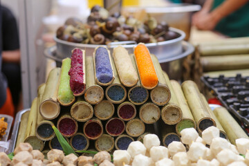 Closeup of colorful bamboo tube rice on the street in the countryside