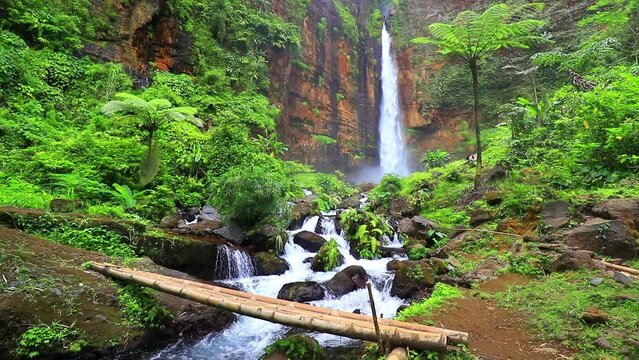 waterfalls and hills, river water flowing in the forest, east java indonesia